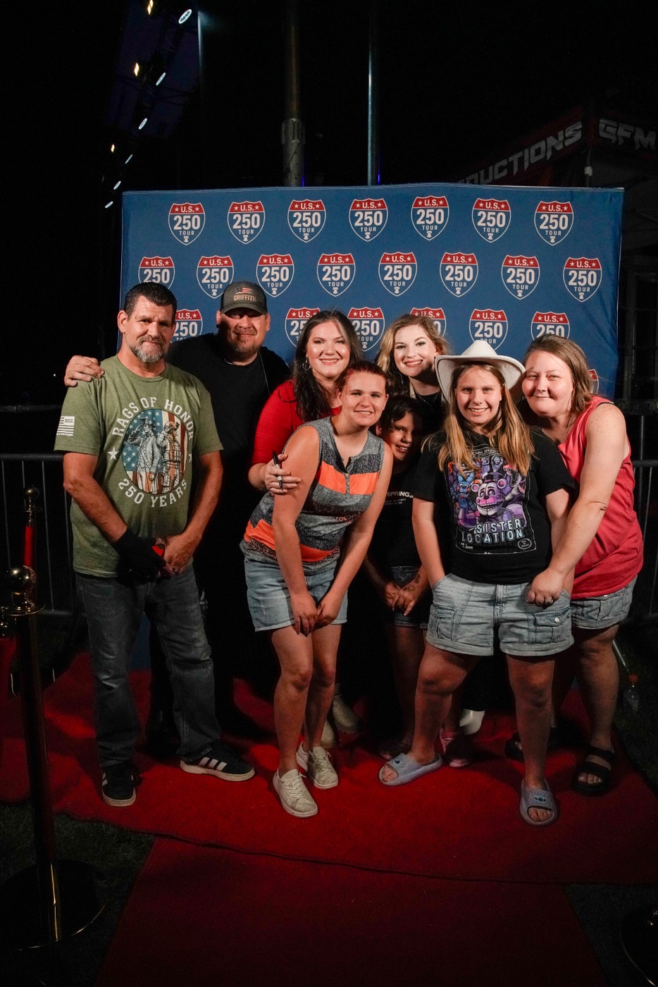 Family photo at the US 250 Tour backdrop